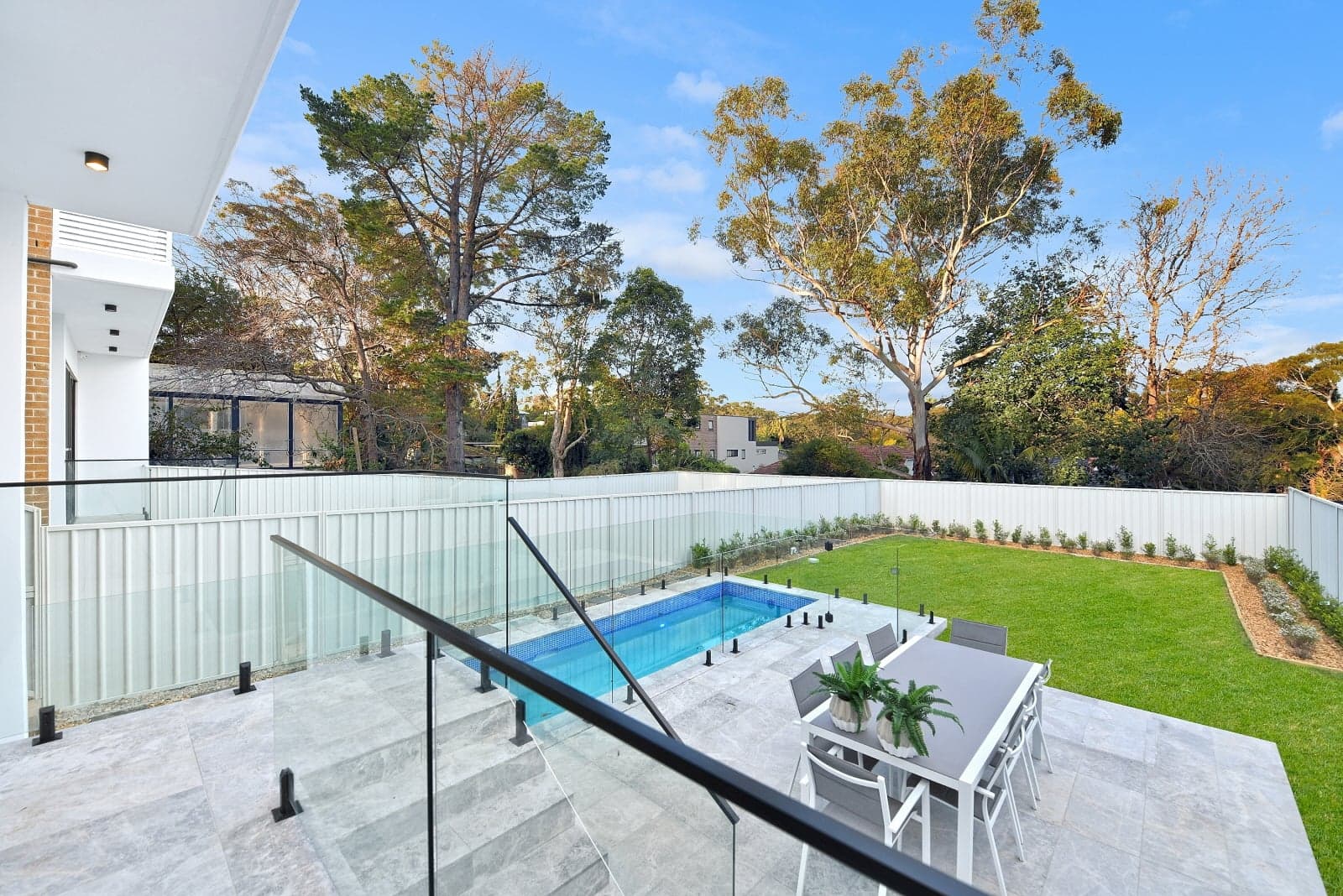 Backyard with swimming pool and outdoor dining