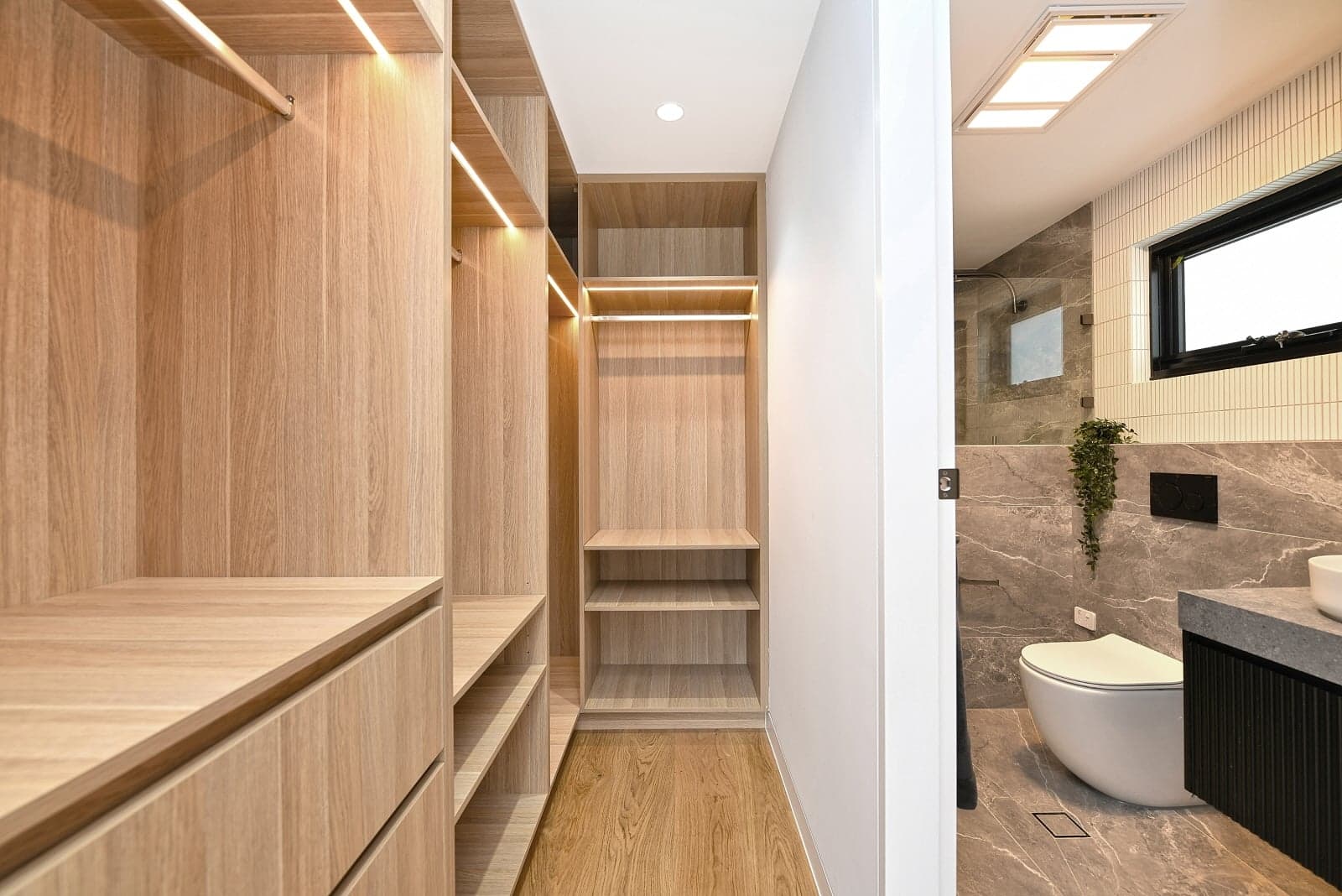 Walk-in wardrobe with timber shelving